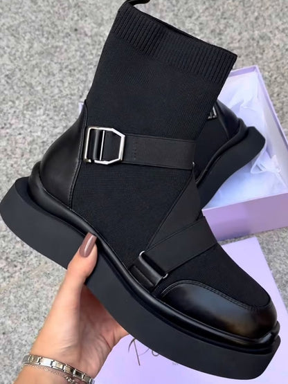 Black high heeled arched boots